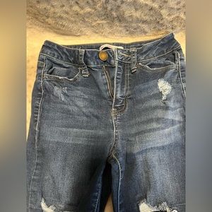 Blue ripped jeans with inner patches
